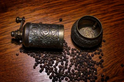 Pepper beans and grinder Stock Photos