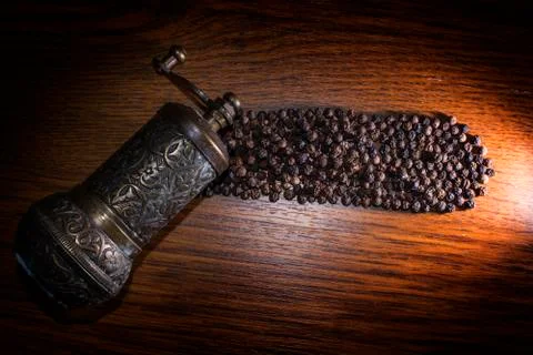 Pepper beans and grinder Stock Photos