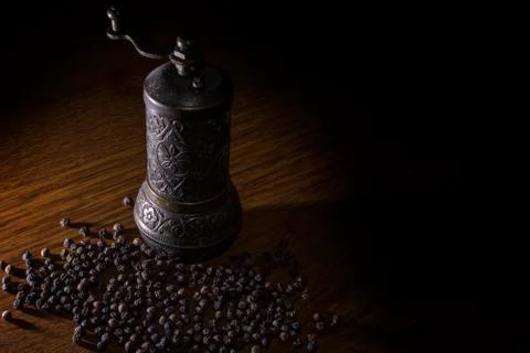 Pepper  beans and grinder Stock Photos