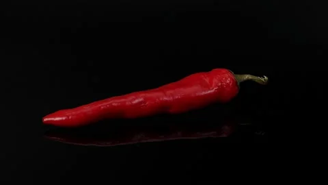 Pepper on black background Video stock 220358369