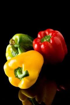 Pepper on black backround Stock Photos