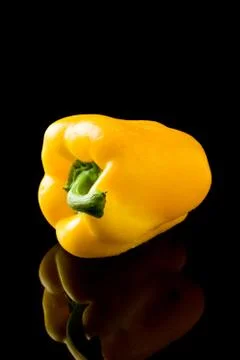 Pepper on black backround Stock Photos