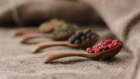 Pepper Blend spices small spoon on top sackcloth Stock Photos