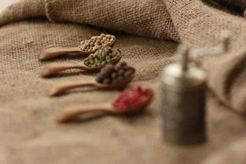 Pepper Blend spices small spoon on top sackcloth Stock Photos