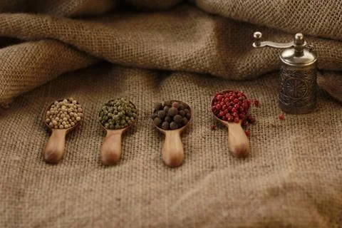 Pepper Blend spices small spoon on top sackcloth Stock Photos