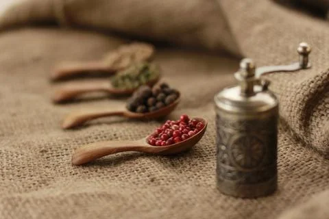 Pepper Blend spices small spoon on top sackcloth Stock Photos