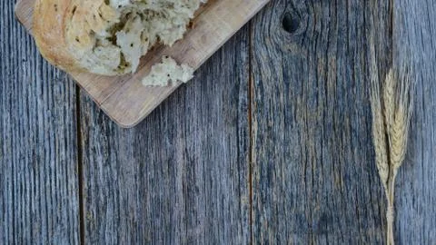 Pepper bread on rustic wood background. Stock Photos