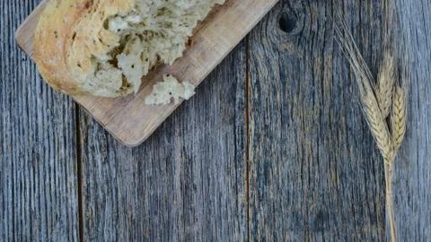 Pepper bread on rustic wood background. Stock Photos