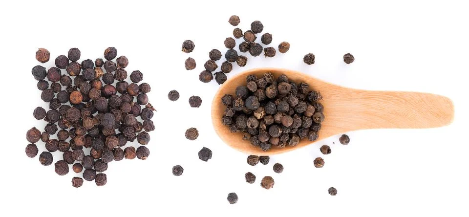 Pepper corn on white background Photos