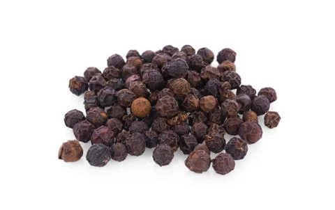 Pepper corn on white background Photos