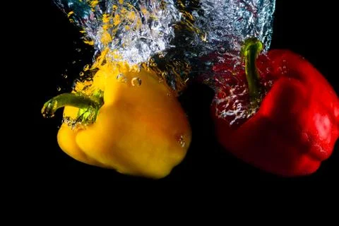 Pepper dive into water Stock Photos