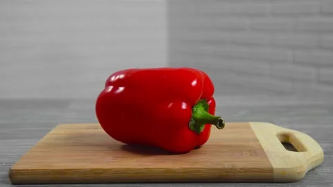 Pepper falls on a cutting board Stock Footage 194426721