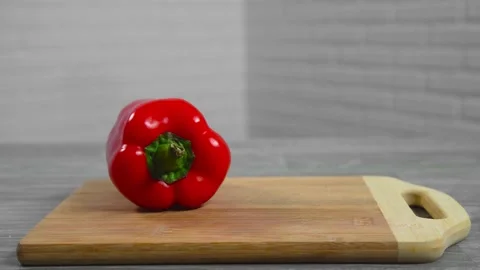 Pepper falls on a cutting board Video stock 194426722
