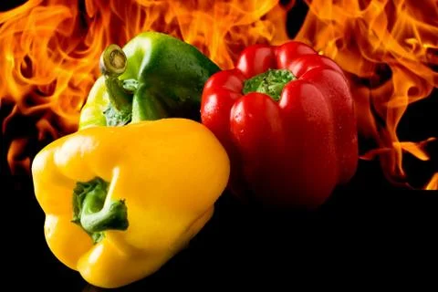 Pepper with fire background Stock Photos