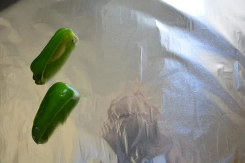 Pepper on a foild different slices Stock Photos
