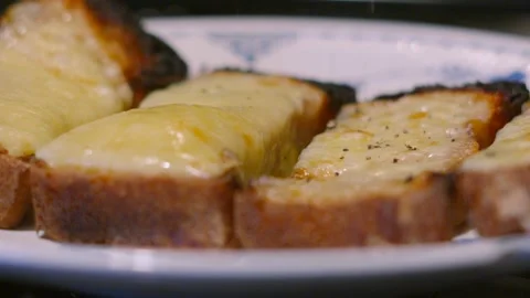 Pepper Granules Falling on Melted Cheese on Homemade Baked Bread Toast in Slow 動画素材 301277015