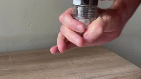 Pepper grinder cracks when grinding pepper Stock Footage 318149611