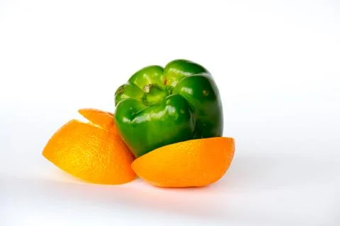 Pepper inside an orange Stock Photos