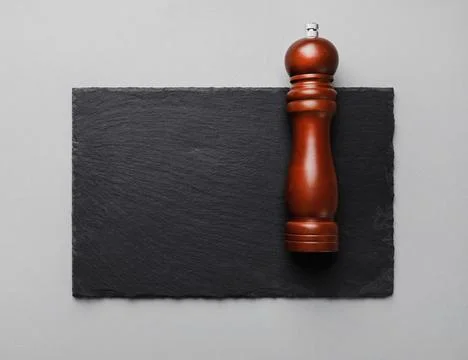 Pepper mill, slate plate Stock Photos