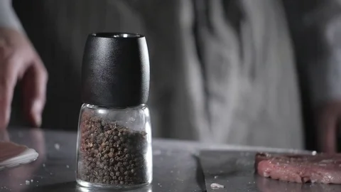 Pepper in mill. Wiener schnitzel . Raw pork ready for marinade with oil. Cooking Stock Footage 84959826