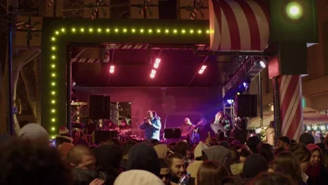 Pepper performs on stage with songs, passers-by enjoy music and dance Stock Footage 228756441