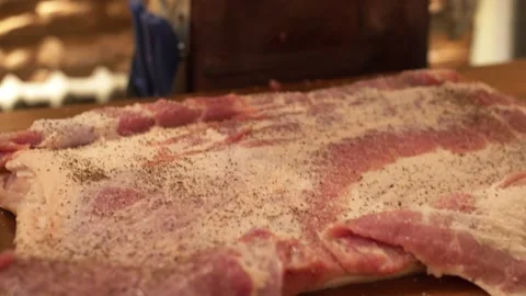 Pepper a Piece of Raw Pork Stock Footage 137899918