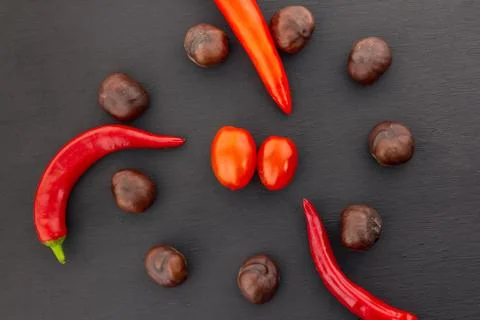 Pepper red sharp circular composition vegetable brown chestnut cherry tomatoe Stock Photos