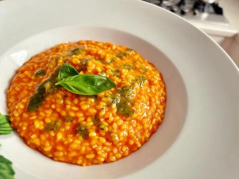 Pepper risotto on a deep plate Stock Photos