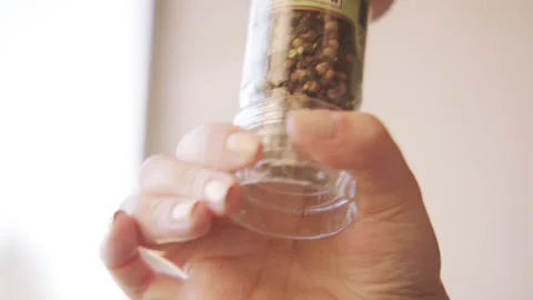 Pepper Shaker in Hand 60fps Stock Footage 179793693