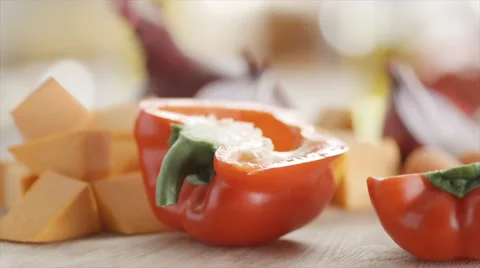 Pepper sliced in reverse in sunny kitchen Stock Footage 48417147