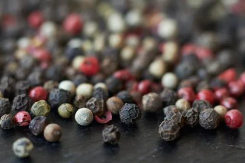 Pepper spice texture. Multicolored pepper corns, mix of colorful grains. Sele Stock Photos