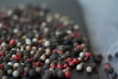 Pepper spice texture. Multicolored pepper corns, mix of colorful grains. Sele Stock Photos