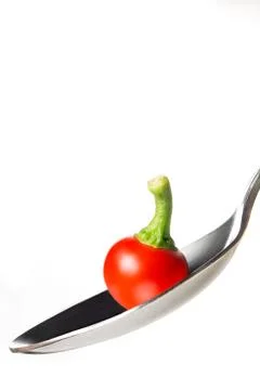 Pepper on spoon Stock Photos