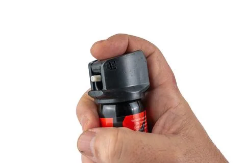 Pepper spray in hand. Stock Photos