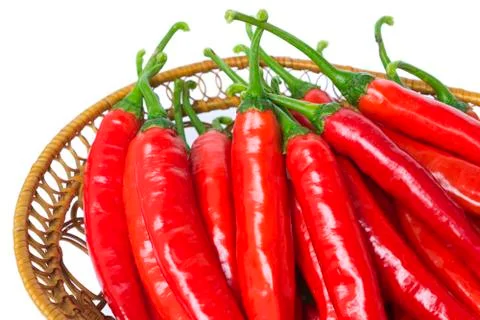 Pepper in a straw dish Stock Photos