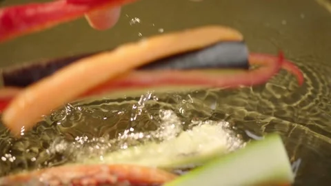 Pepper Strips Dropped into Sizzling Hot Oil Slow Motion Close Up 4K Vídeos de archivo 347364464