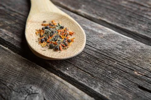 Pepper in wooden spoon Stock Photos