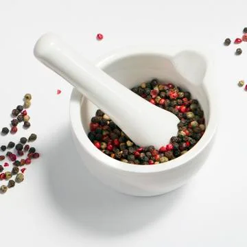 Peppercorns in a mortar Stock Photos