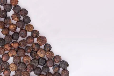 Peppercorns on white Stock Photos