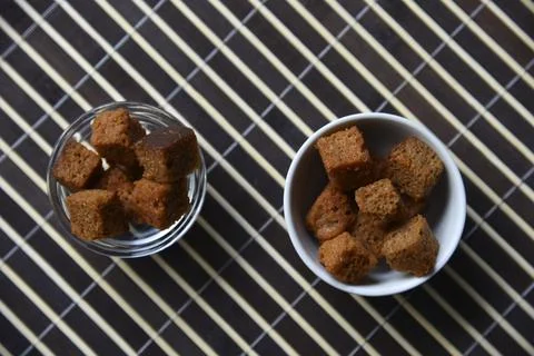 Peppered bread crackers with spices in plates 스톡 사진