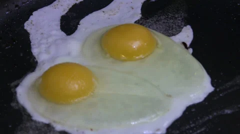 Peppering Frying Eggs Stock Footage 36316937