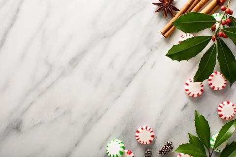 Peppermint candy and spices on marble background Stock Photos