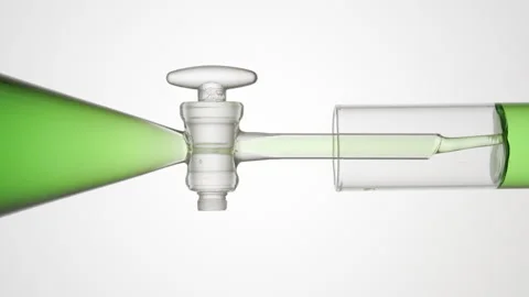 Peppermint hydrosol flows from funnel into test tube filling Stock Footage 325352671