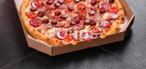 Pepperoni Pizza with Mozzarella cheese, salami, ham. Italian pizza on a ...