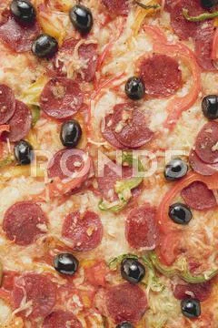 Pepperoni pizza with peppers and olives (full-frame) Stock Photos