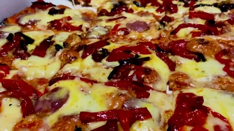 Pepperoni pizza shared with a hand taking a slice Stock Footage 251793601