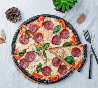 Pepperoni pizza slices on the table Stock Photos