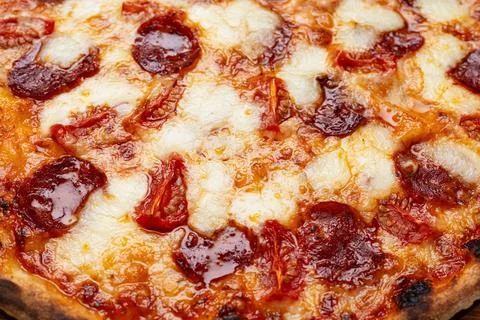 Pepperoni pizza texture with mozzarella cheese Stock Photos
