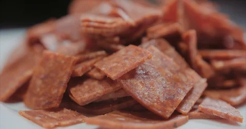 Pepperonis on a white plate in a restaurant Stock Footage 105302441