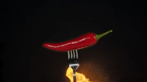 Peppers and flames in slow motion Stock Footage 140112816